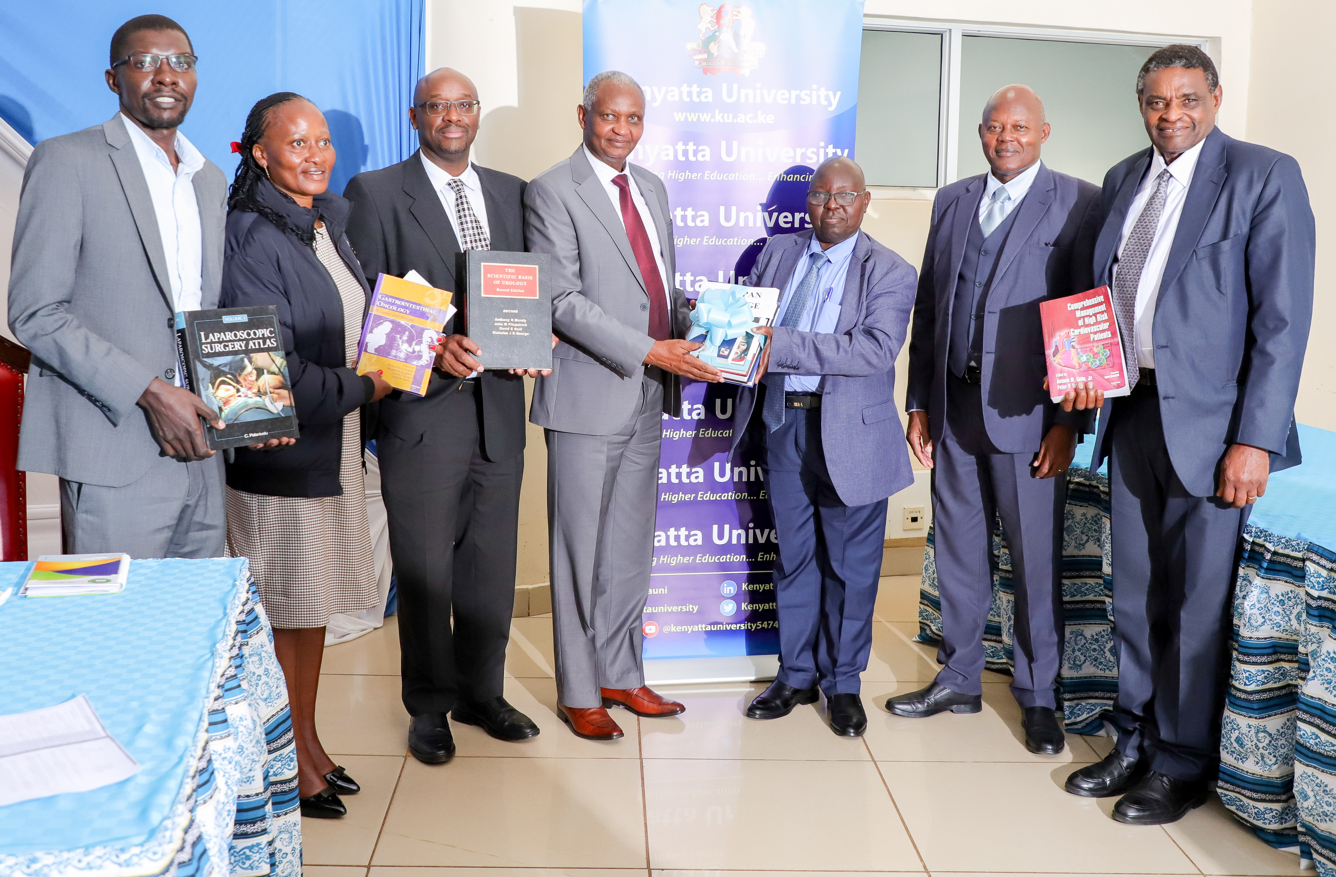 OMC team receiving books